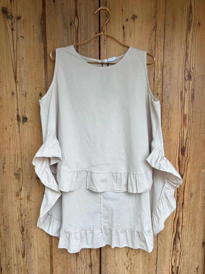 Blusa delantal volante